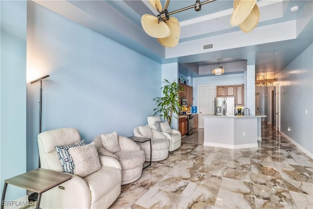 2797 1st St Unit 2003, Fort Myers, FL 33916 - living area featuring a raised ceiling, visible vents, marble finish floor, and baseboards