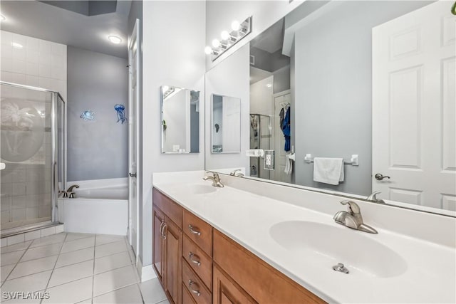 2797 1st St Unit 2003, Fort Myers, FL 33916 - full bathroom with a garden tub, tile patterned floors, a sink, and a stall shower