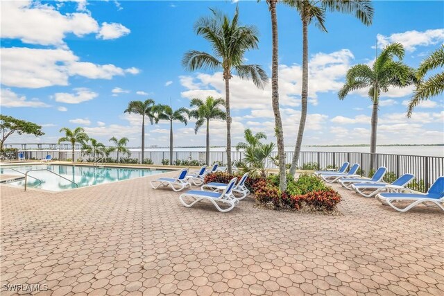 2797 1st St Unit 2003, Fort Myers, FL 33916 - community pool featuring fence, a water view, and a patio