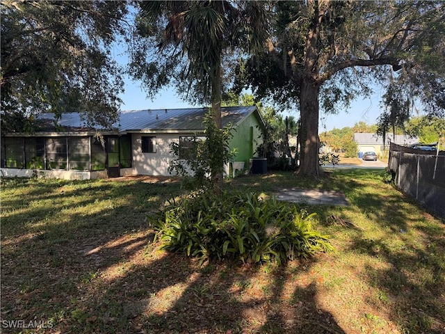 4004 Sena Ln, Labelle, FL 33935 - view of yard featuring central AC unit and a sunroom