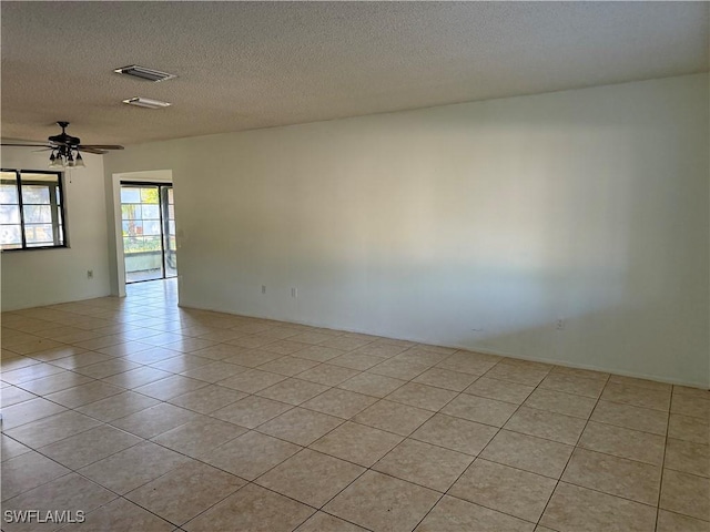 4004 Sena Ln, Labelle, FL 33935 - spare room with a textured ceiling, visible vents, ceiling fan, and light tile patterned floors