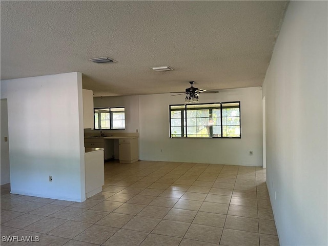 4004 Sena Ln, Labelle, FL 33935 - unfurnished room featuring visible vents, a ceiling fan, a sink, light tile patterned flooring, and a textured ceiling