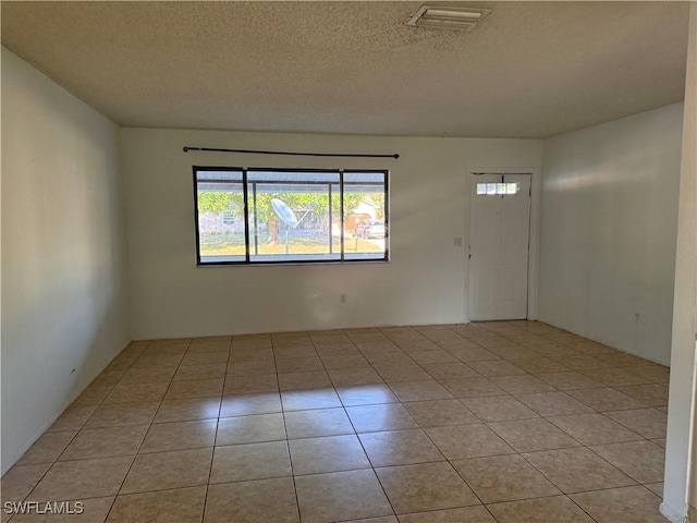 4004 Sena Ln, Labelle, FL 33935 - unfurnished room with light tile patterned flooring, a textured ceiling, and visible vents