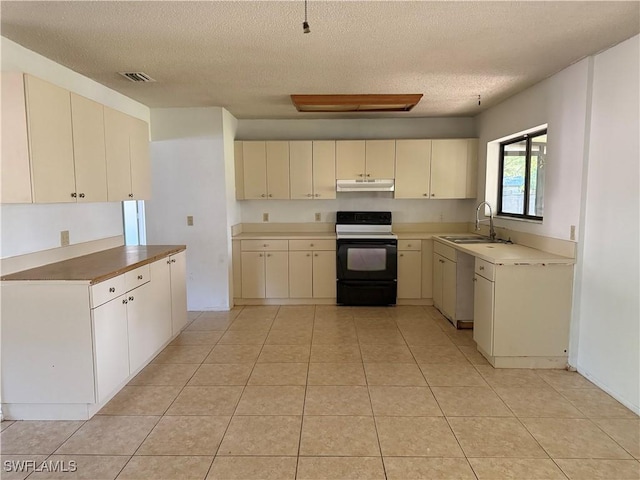 4004 Sena Ln, Labelle, FL 33935 - kitchen featuring range with electric cooktop, cream cabinetry, under cabinet range hood, and a sink