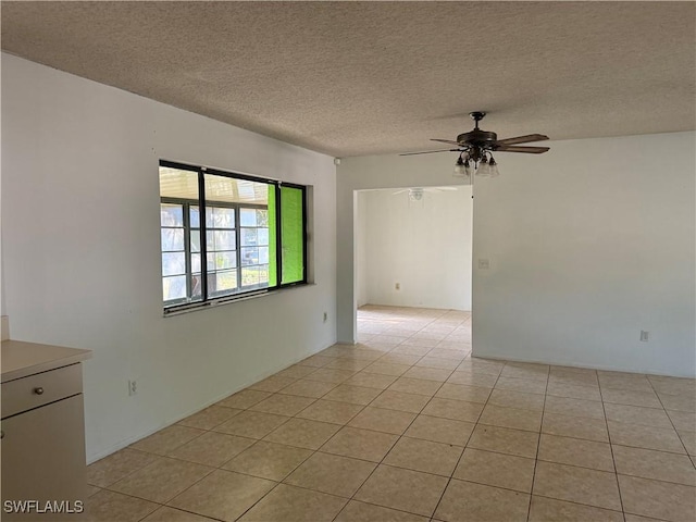 4004 Sena Ln, Labelle, FL 33935 - unfurnished room featuring a ceiling fan, a textured ceiling, and light tile patterned floors