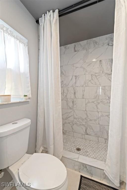 2748 45th Ave NE, Naples, FL 34120 - full bath with a tile shower and toilet