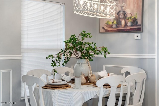2748 45th Ave NE, Naples, FL 34120 - dining room featuring an inviting chandelier