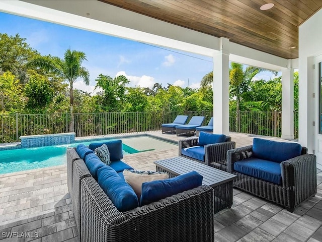 201 S Heathwood Dr, Marco Island, FL 34145 - view of patio with a fenced backyard, an outdoor hangout area, and a fenced in pool