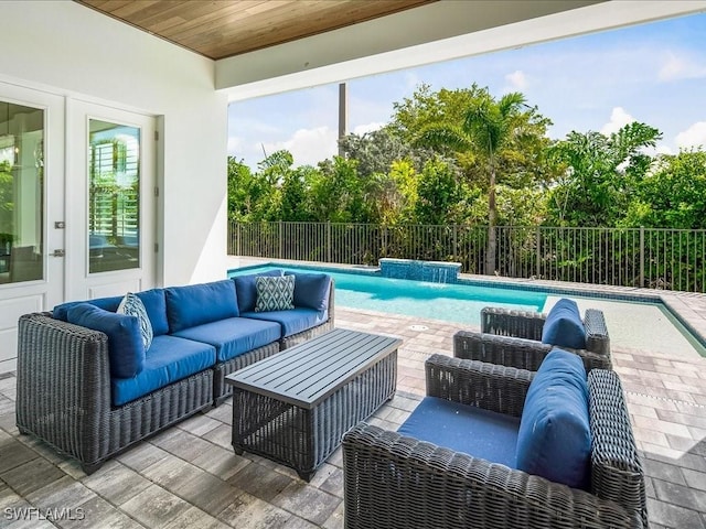 201 S Heathwood Dr, Marco Island, FL 34145 - view of patio with a fenced backyard, a fenced in pool, french doors, and an outdoor hangout area