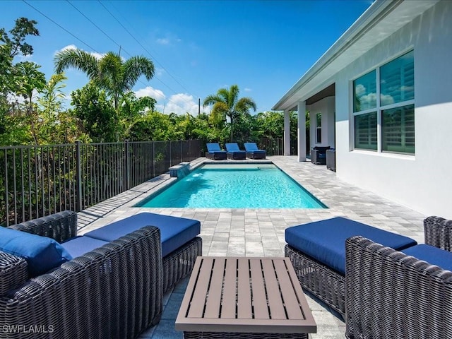 201 S Heathwood Dr, Marco Island, FL 34145 - view of pool featuring a fenced backyard, a patio, a fenced in pool, and an outdoor hangout area