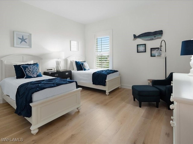 201 S Heathwood Dr, Marco Island, FL 34145 - bedroom with light wood-style flooring and baseboards