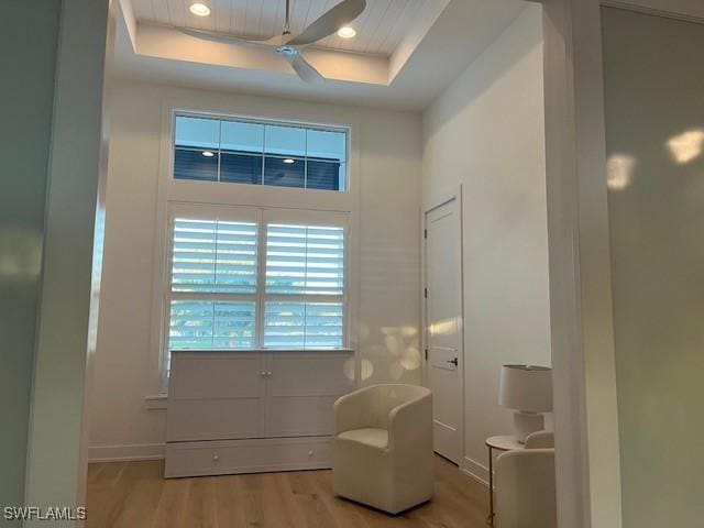 201 S Heathwood Dr, Marco Island, FL 34145 - sitting room featuring baseboards, wood finished floors, and a raised ceiling