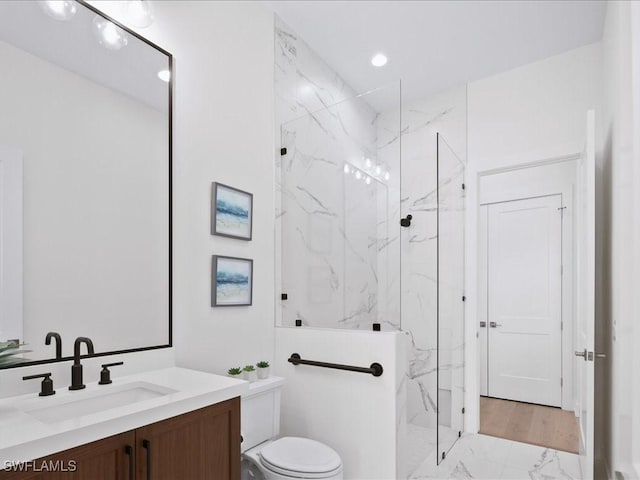 201 S Heathwood Dr, Marco Island, FL 34145 - bathroom with marble finish floor, toilet, vanity, and a marble finish shower