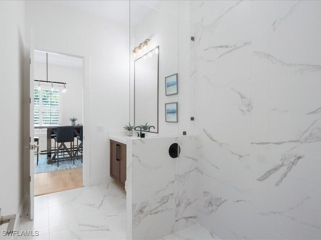 201 S Heathwood Dr, Marco Island, FL 34145 - full bath with baseboards, vanity, marble finish floor, and a marble finish shower
