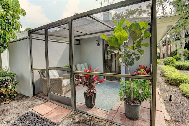exterior space with a lanai, a patio, and stucco siding