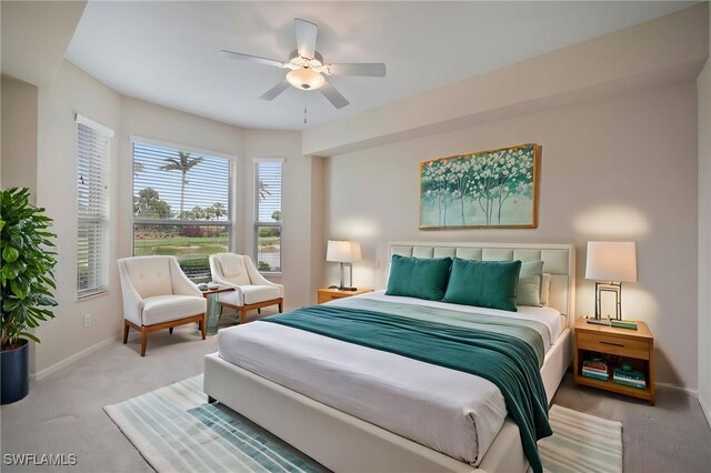 bedroom with baseboards, a ceiling fan, and carpet flooring