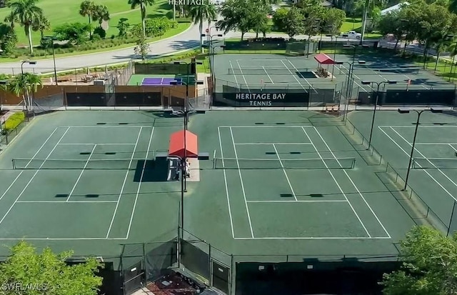 view of tennis court featuring fence