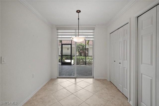 unfurnished dining area with baseboards, ornamental molding, and light tile patterned floors