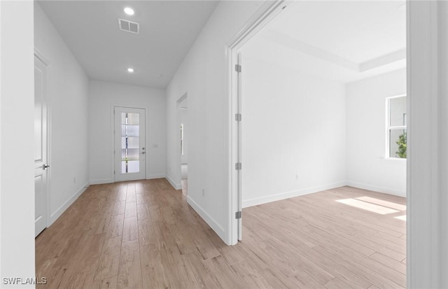 interior space with visible vents, recessed lighting, light wood finished floors, and plenty of natural light