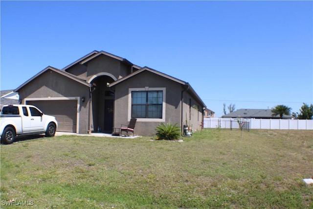 509 SW 28th St, Cape Coral, FL 33914 - ranch-style home featuring stucco siding, a front lawn, fence, and a garage