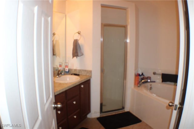 509 SW 28th St, Cape Coral, FL 33914 - bathroom featuring vanity, a garden tub, and a stall shower