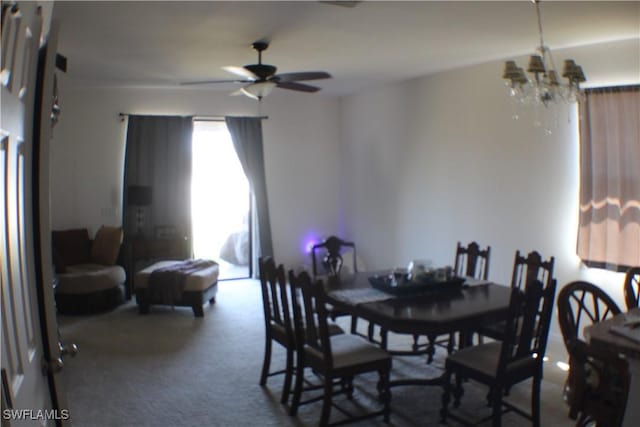 509 SW 28th St, Cape Coral, FL 33914 - dining area featuring carpet floors and ceiling fan with notable chandelier