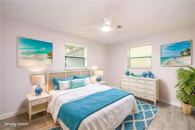 27525 Michigan St, Bonita Springs, FL 34135 - bedroom featuring baseboards, a ceiling fan, visible vents, and light wood-style flooring
