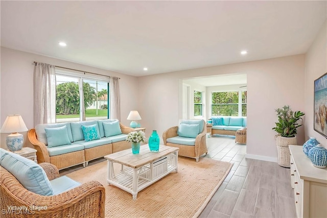 27525 Michigan St, Bonita Springs, FL 34135 - living area featuring recessed lighting, light wood-style flooring, a healthy amount of sunlight, and baseboards