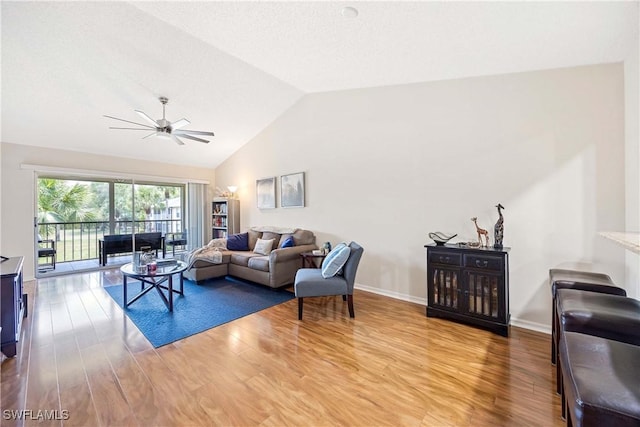 733 Landover Ct Unit 203, Naples, FL 34104 - living area with lofted ceiling, a ceiling fan, light wood finished floors, and baseboards