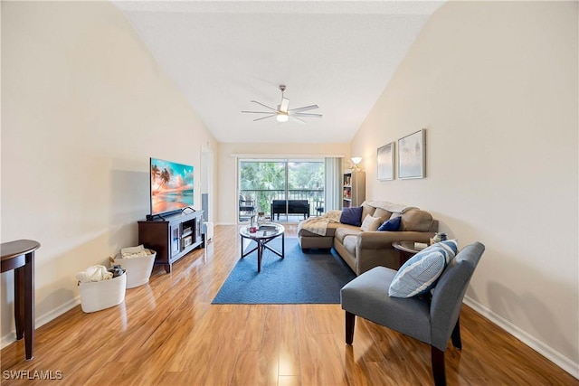 733 Landover Ct Unit 203, Naples, FL 34104 - living area featuring vaulted ceiling, a ceiling fan, and light wood-style flooring