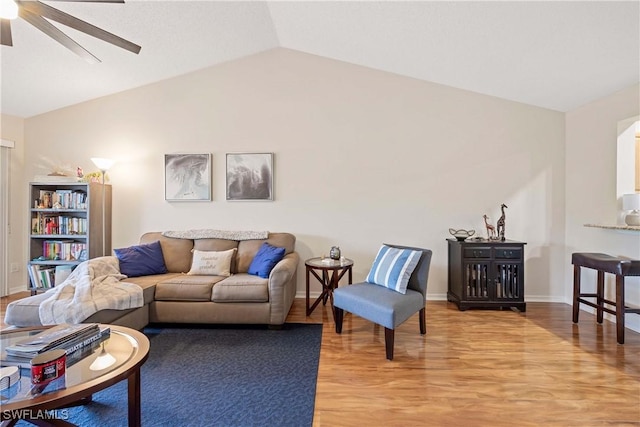 733 Landover Ct Unit 203, Naples, FL 34104 - living area featuring light wood finished floors, vaulted ceiling, baseboards, and ceiling fan