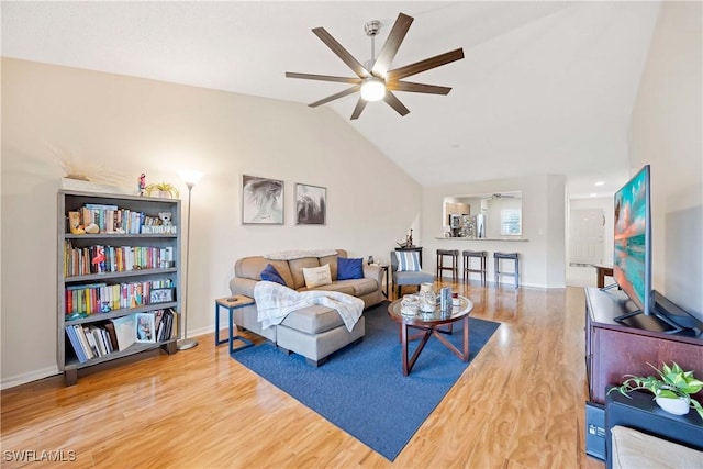 733 Landover Ct Unit 203, Naples, FL 34104 - living room with vaulted ceiling, wood finished floors, a ceiling fan, and baseboards
