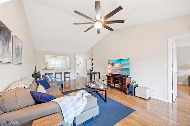 733 Landover Ct Unit 203, Naples, FL 34104 - living area with light wood-style flooring, baseboards, high vaulted ceiling, and ceiling fan