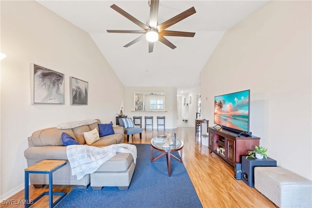 733 Landover Ct Unit 203, Naples, FL 34104 - living room featuring baseboards, light wood finished floors, high vaulted ceiling, and ceiling fan