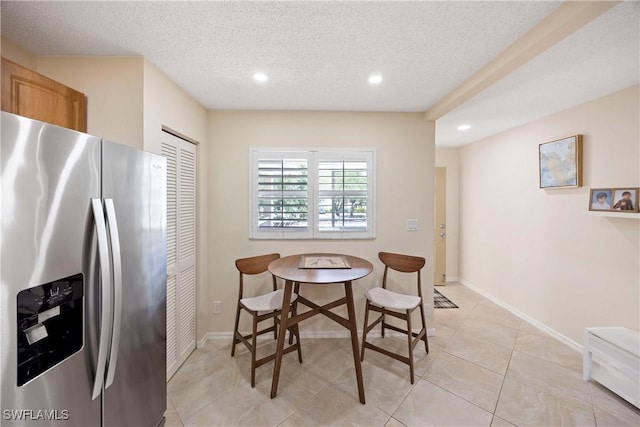 733 Landover Ct Unit 203, Naples, FL 34104 - dining space featuring baseboards, recessed lighting, a textured ceiling, and light tile patterned flooring