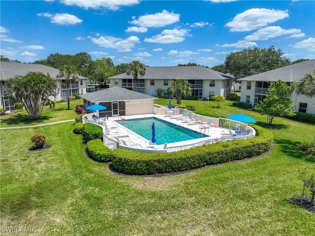 733 Landover Ct Unit 203, Naples, FL 34104 - community pool with a residential view, a lawn, a patio, and fence