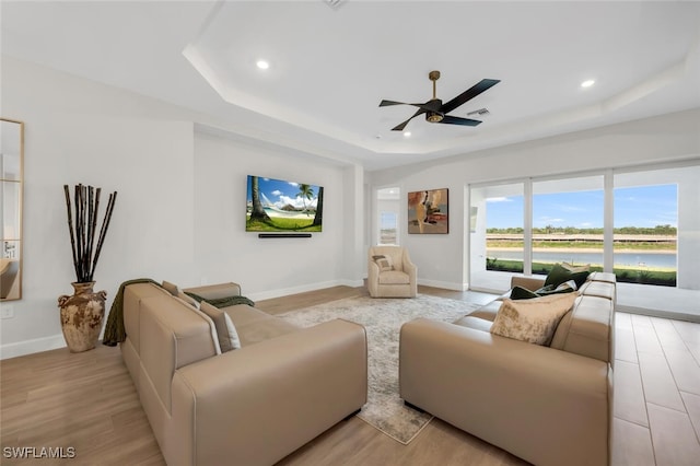 15766 Cortina St, Naples, FL 34114 - living area with a raised ceiling, wood finished floors, ceiling fan, baseboards, and recessed lighting
