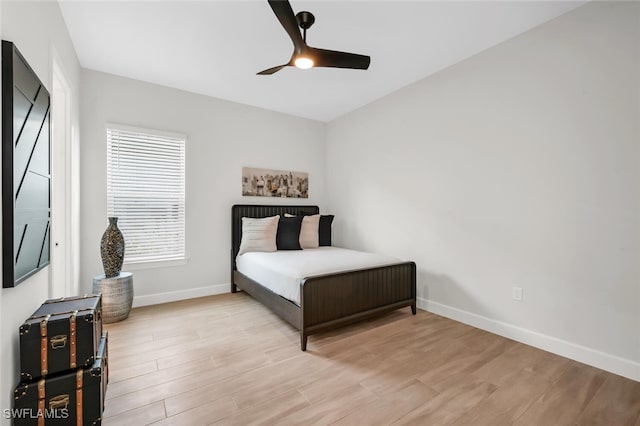 15766 Cortina St, Naples, FL 34114 - bedroom with baseboards, light wood finished floors, and a ceiling fan