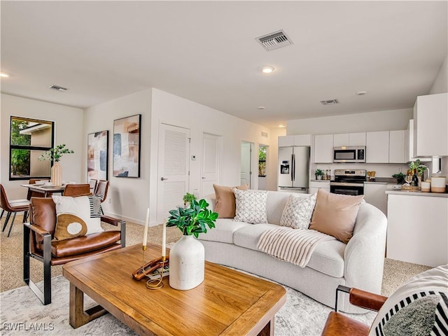 809 Bell Blvd S, Lehigh Acres, FL 33974 - living area with recessed lighting, visible vents, baseboards, and light carpet