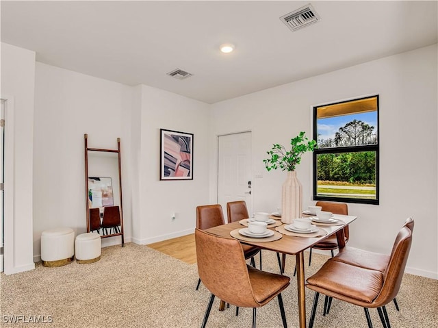809 Bell Blvd S, Lehigh Acres, FL 33974 - dining area with baseboards, light carpet, visible vents, and recessed lighting