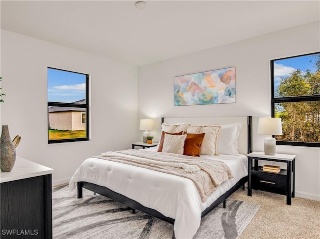809 Bell Blvd S, Lehigh Acres, FL 33974 - bedroom with baseboards and light carpet