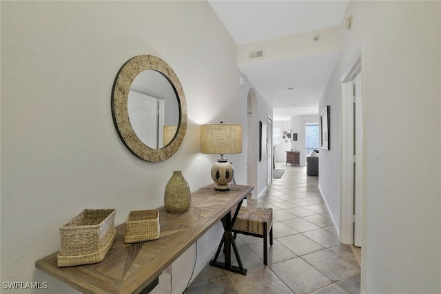6824 Sterling Greens Pl Unit 3304, Naples, FL 34104 - hall featuring light tile patterned floors and baseboards