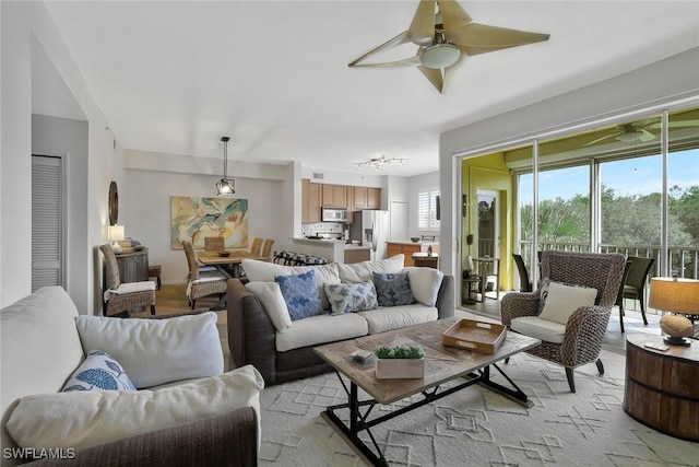 6824 Sterling Greens Pl Unit 3304, Naples, FL 34104 - living room featuring a ceiling fan