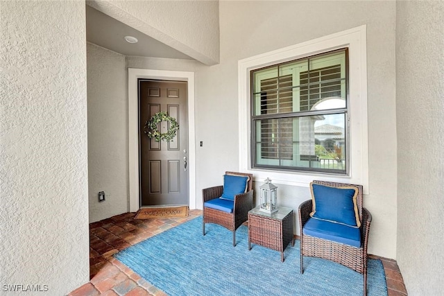 property entrance featuring stucco siding