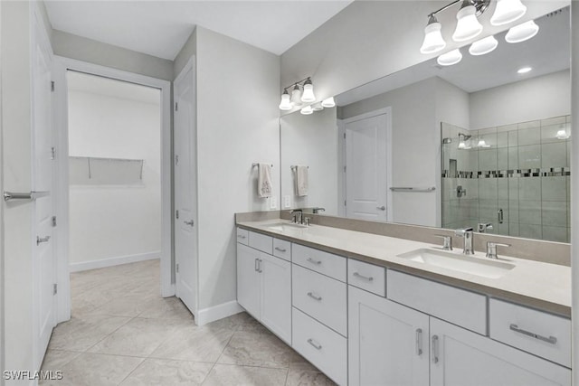 bathroom with marble finish floor, a sink, double vanity, and a stall shower