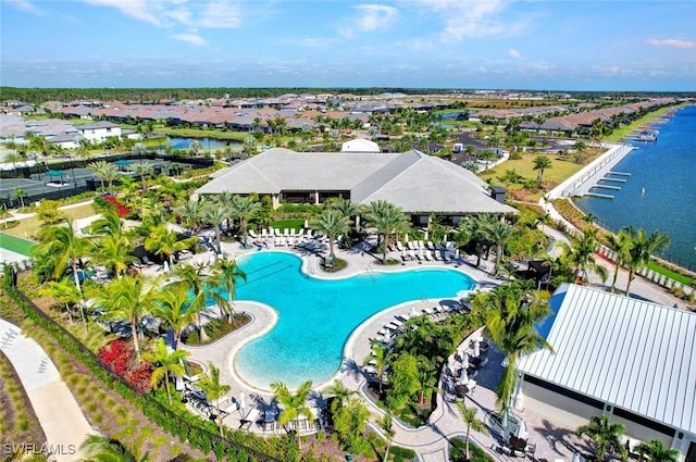 drone / aerial view with a residential view and a water view