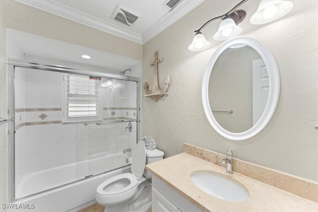 bathroom featuring crown molding, toilet, vanity, and enclosed tub / shower combo