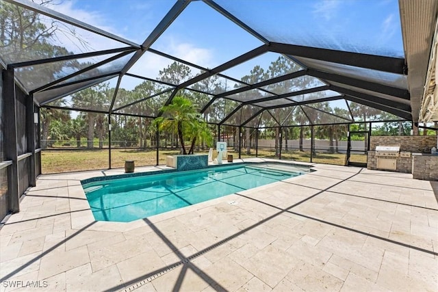 swimming pool featuring exterior kitchen and a patio area