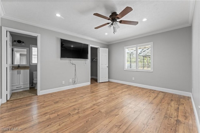 unfurnished bedroom with light wood finished floors, baseboards, recessed lighting, connected bathroom, and ornamental molding