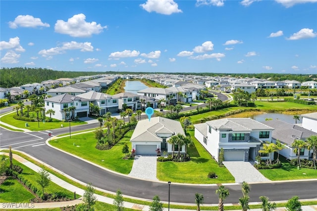 aerial view featuring a residential view and a water view